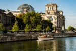 spree river, boat, buildings on trip visiting berlin germany
