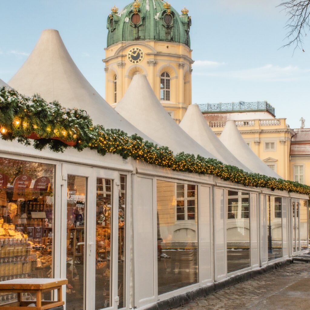 at christmas berlin market with palace and white tent
