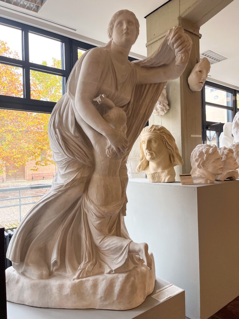 stone sculpture of a women in a berlin free museum