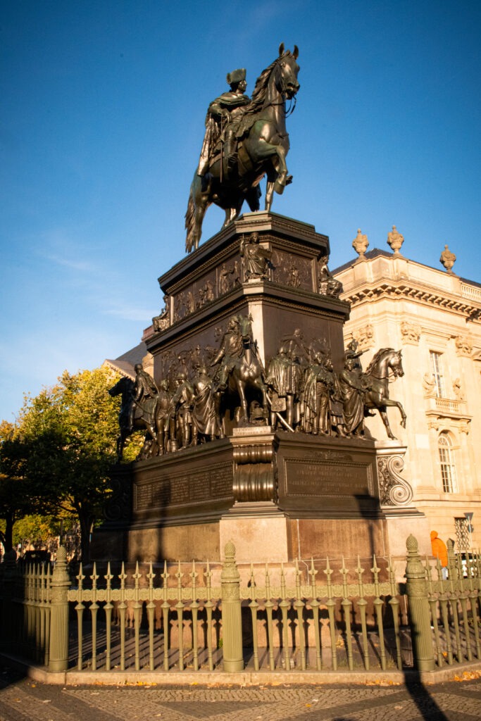 large metal statue of solider on horse on unter den linden street