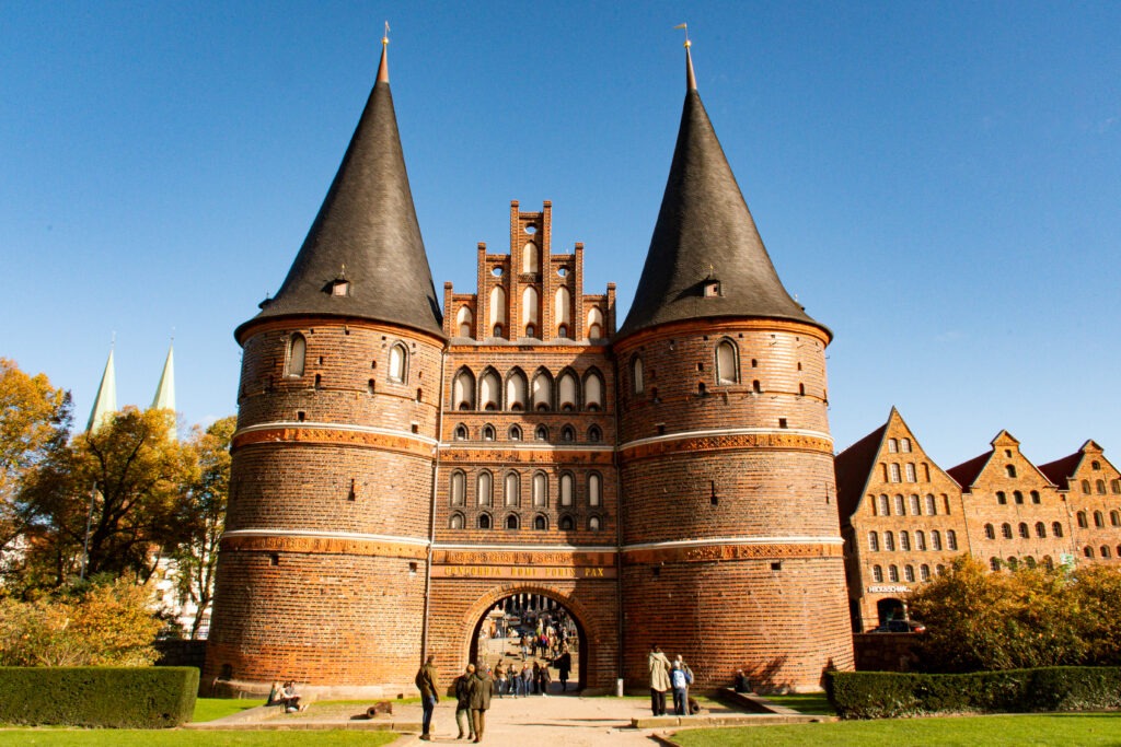tall red brick gate with 2 sphere towers as things to do Lubeck