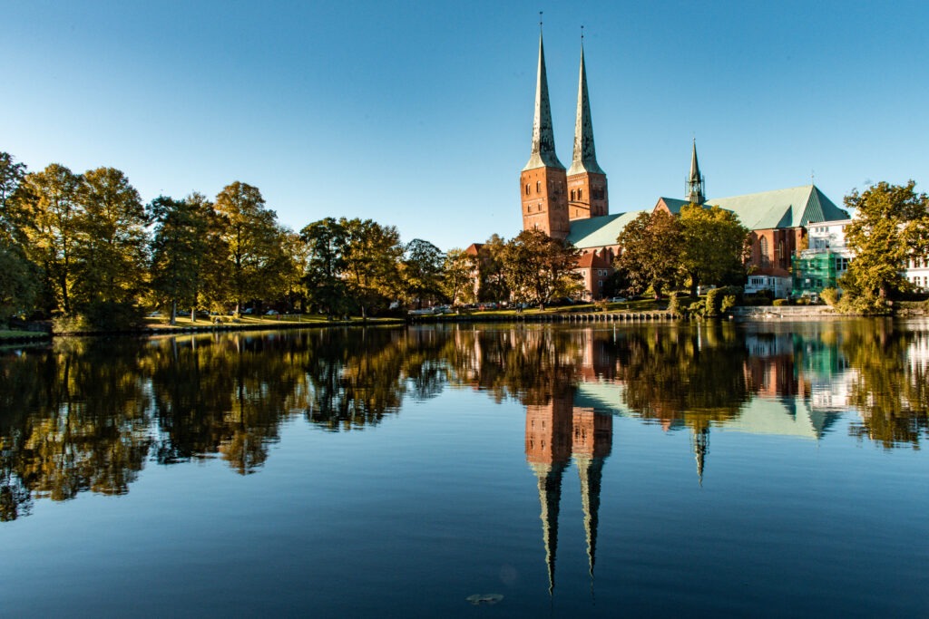 water reflection of church and town of lubeck germany