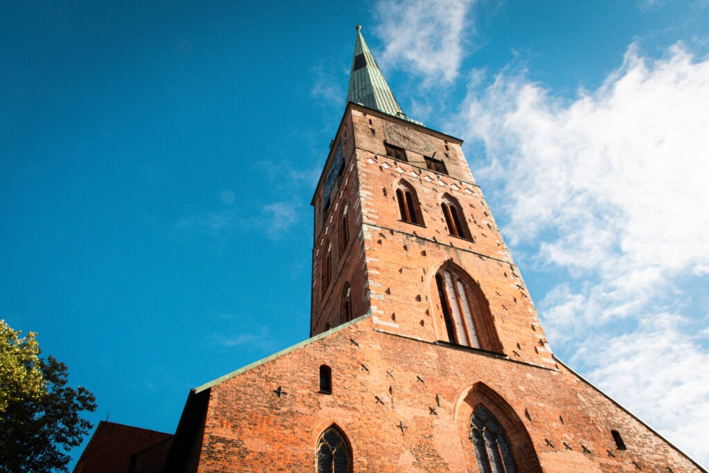 red brick church with spire as things to do in lubeck germany