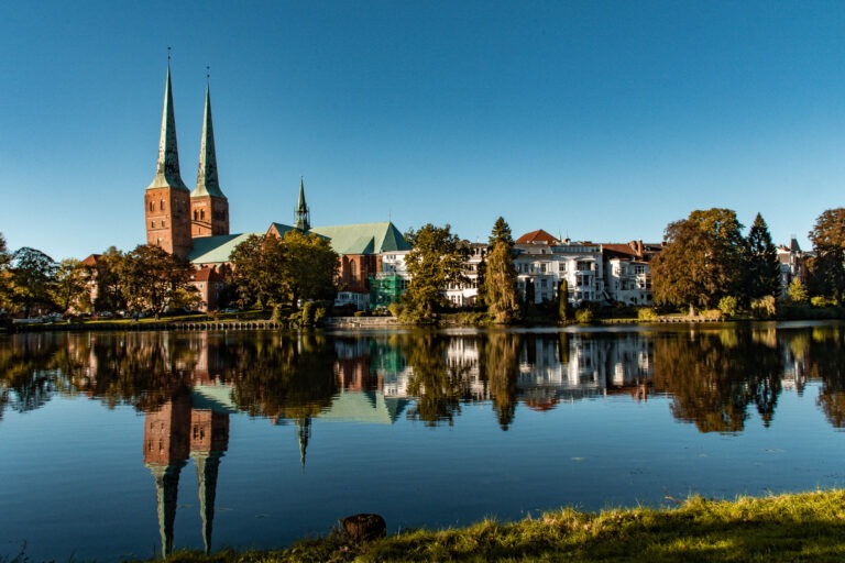 water reflection of town of lubeck germany with church