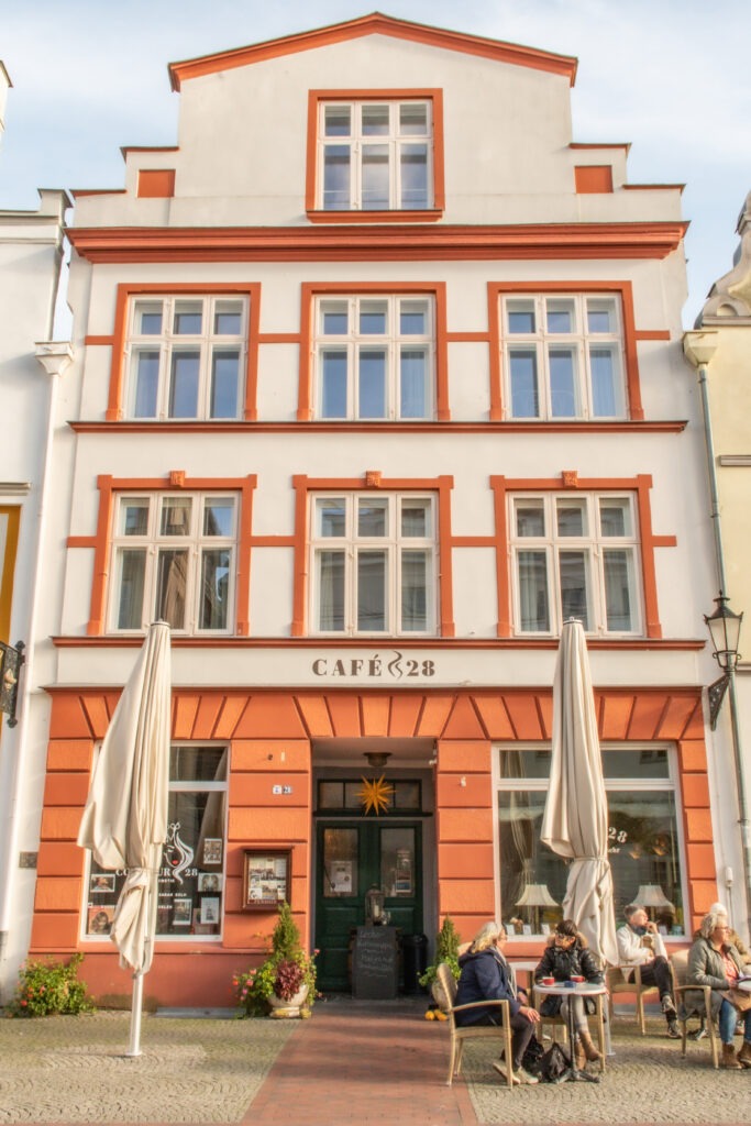 white and red building in old town as things to do in wismar germany