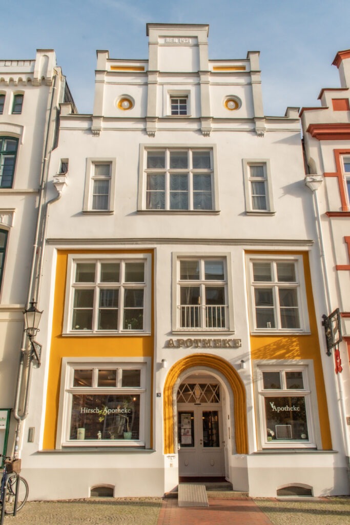 white and yellow building in old town as things to do in wismar germany