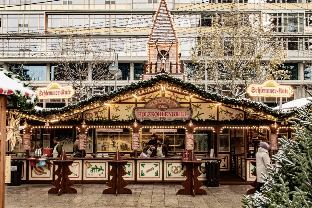 berlin christmas market with booth for food with lights