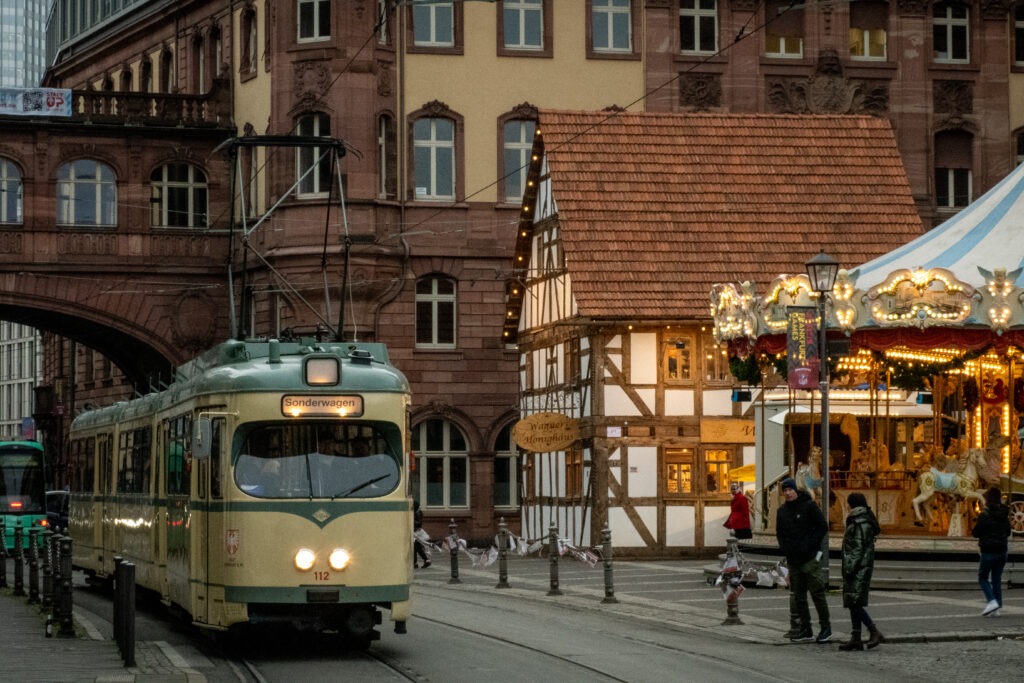 tram, carousel and half timbered building at christmas market frankfurt dates