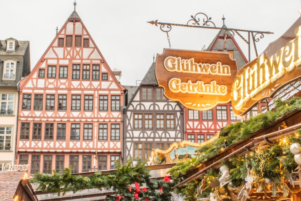 timberframe buildings with sign selling gluhwein at frankfurt christmas market