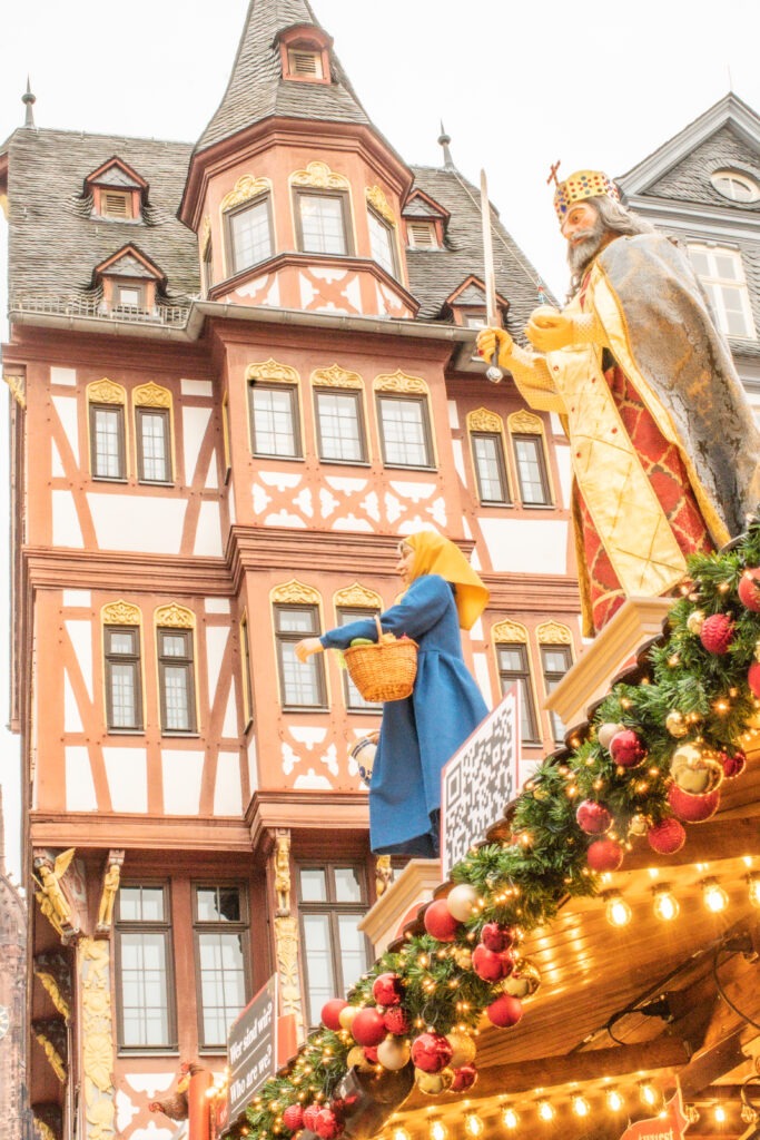 half timbered building with top of christmas market in frankfurt