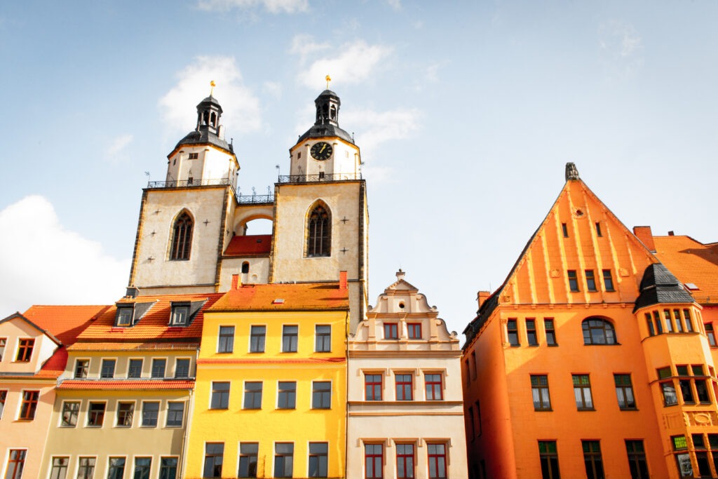 colourful buildings with church steeple on German road trip