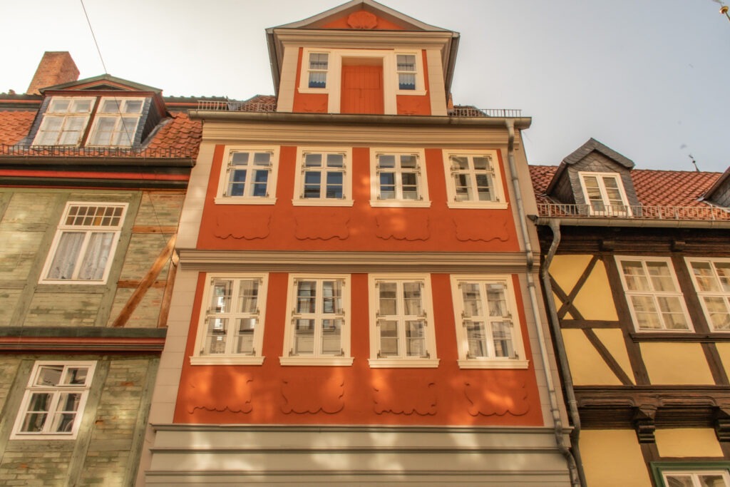 half timbered building in orange and white on road trip in germany 