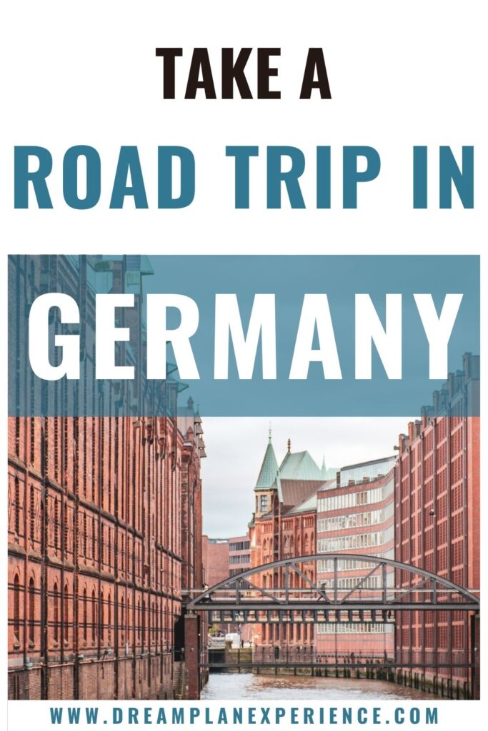 tall red brick buildings between river in hamburg on germany road trip itinerary