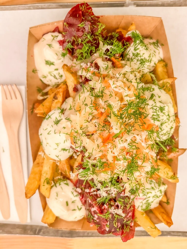 fries with mayo, beets and kraut on best berlin food tours