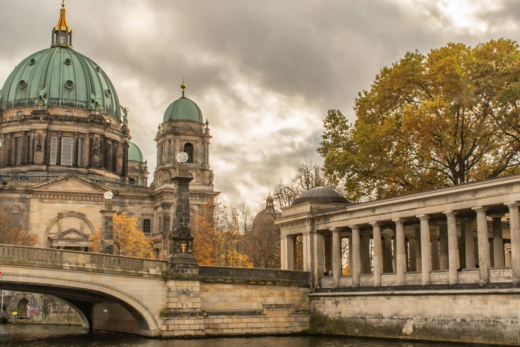 from a boat tour berlin there is the berliner dom  cathedral and long archway with bridge