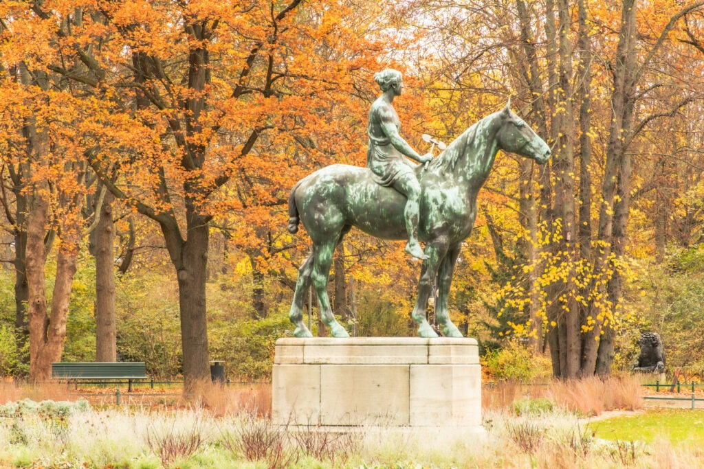amazon on horseback statue with trees in berlin tiergarten park