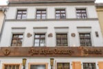 whitel stucco building is the best traditional german restaurant in berlin with sign reading zur letzten instanz