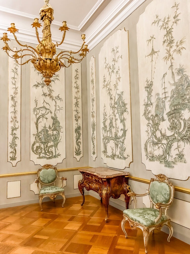 two chairs, dresser, and ornate walls schloss charlottenburg berlin