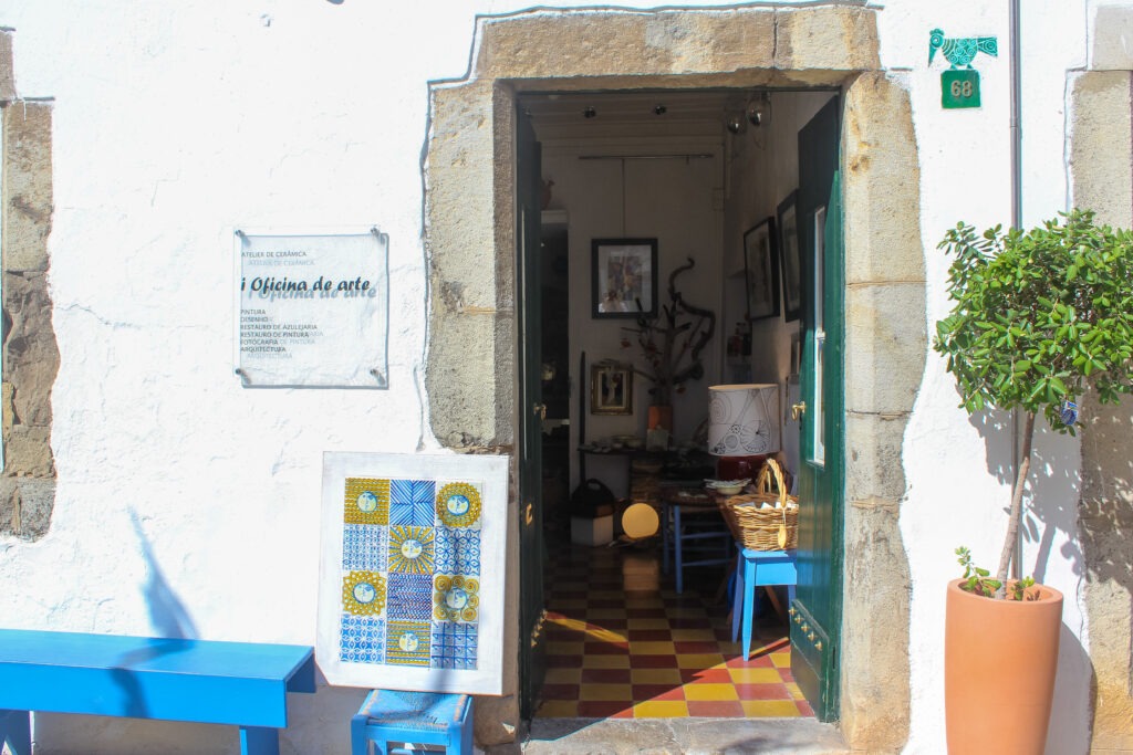 store front with art at doorway in tavira portugal things to do