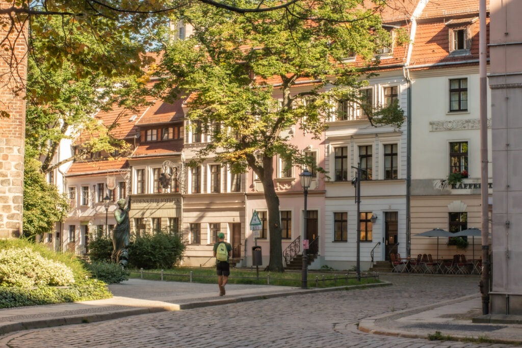 row of buildings with cobblestone street on 1 day Berlin itinerary