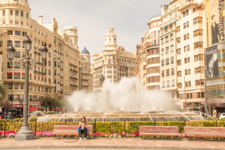 grand square with buildings and fountain with tourist asking how many days in valencia spain are enough