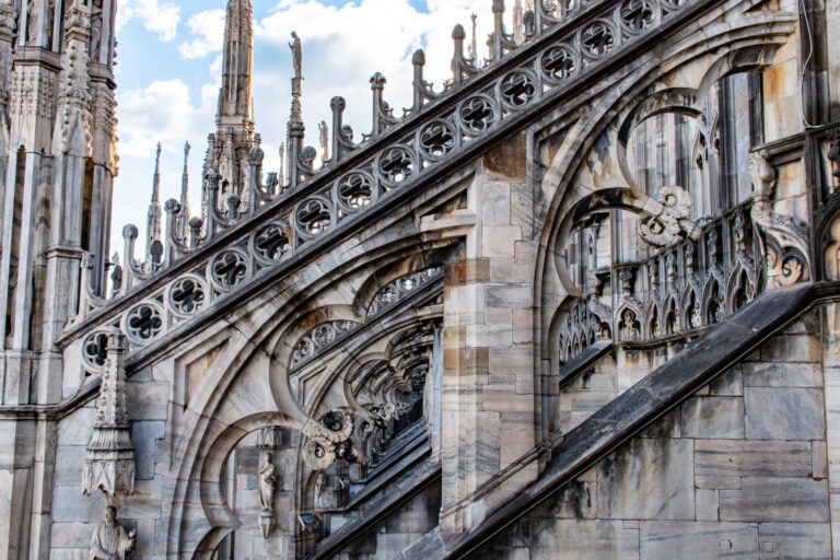 on the rooftop of the milan duomo walking amongst the cloisters