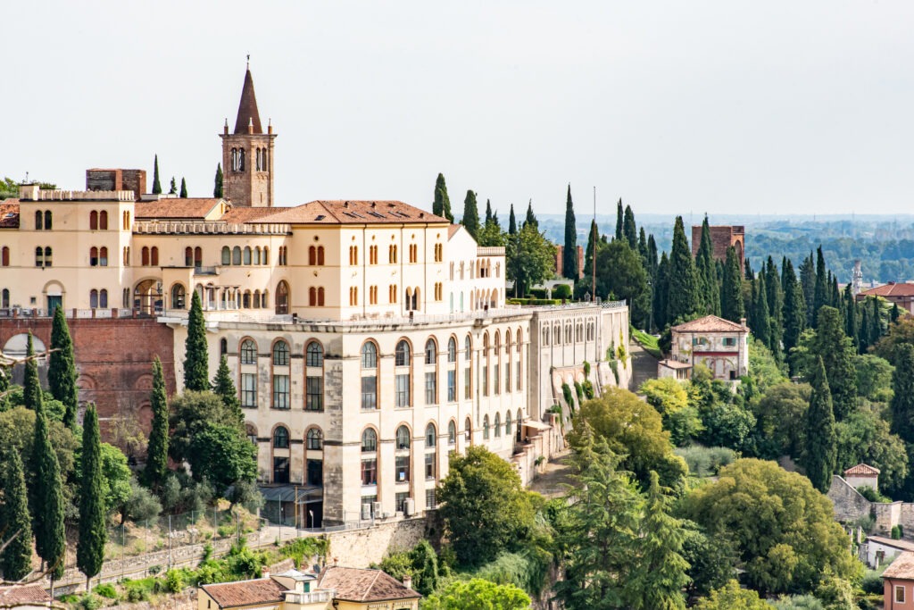 verona palace on hill surrounded by green trees