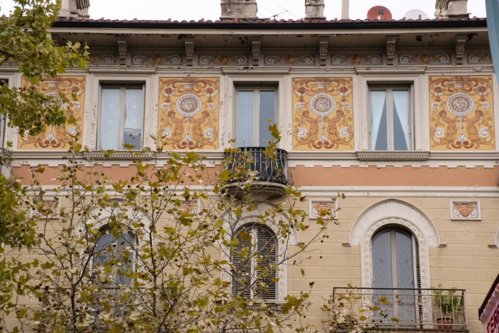 Art Nouveau in Turin: Where to Walk for Liberty Style 5 intricate details on side of building with iron balconies in turin