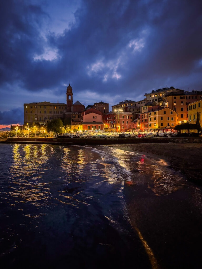 at night, sea with colourful buildings and lights in italy