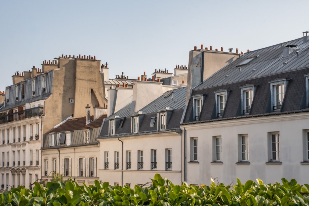 4 Paris Saint-Germain Apartment Rentals I Recommend 1 Classic Paris rooftops and Haussmann buildings viewed from a Saint-Germain-des-Prés apartment rental