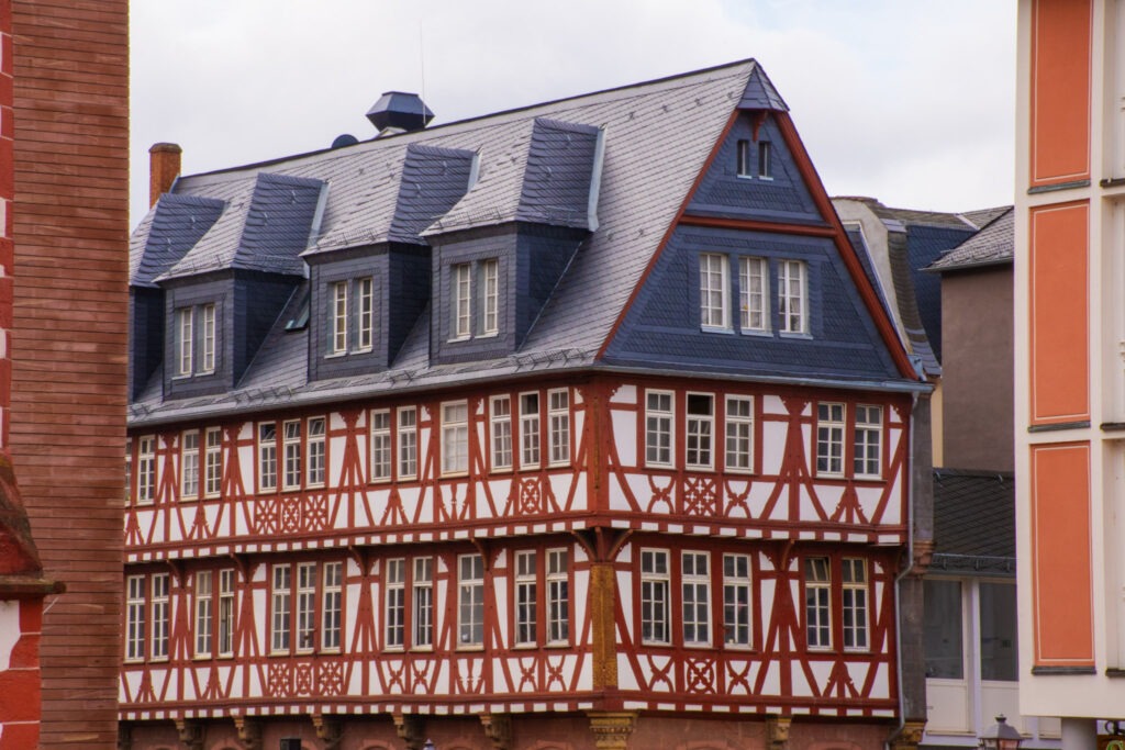 half timbered building with red and white with gray roof is one of the attractions in Frankfurt Germany