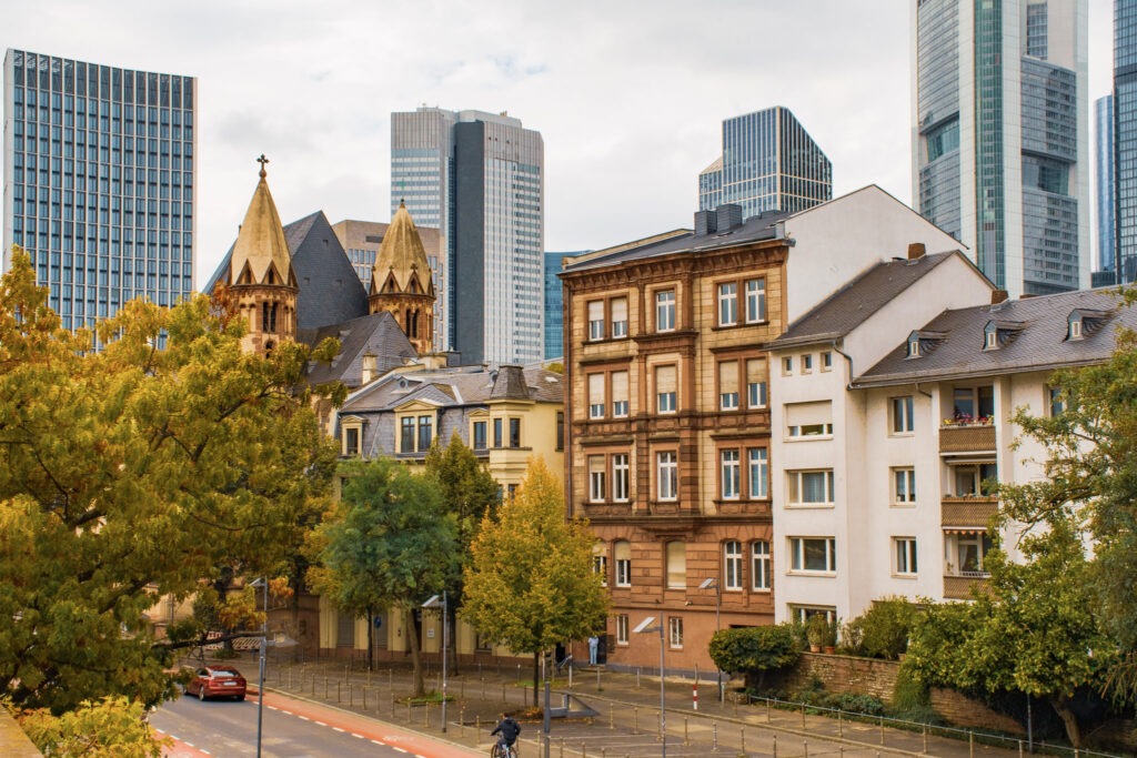 old city architecture in front of tall skyscrapers in frankfurt
