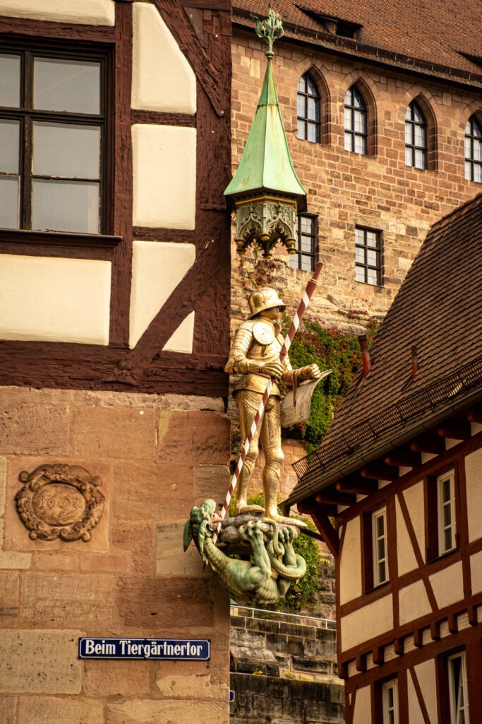 timberframed building with gold medieval statue on the side while in nuremberg for 2 days