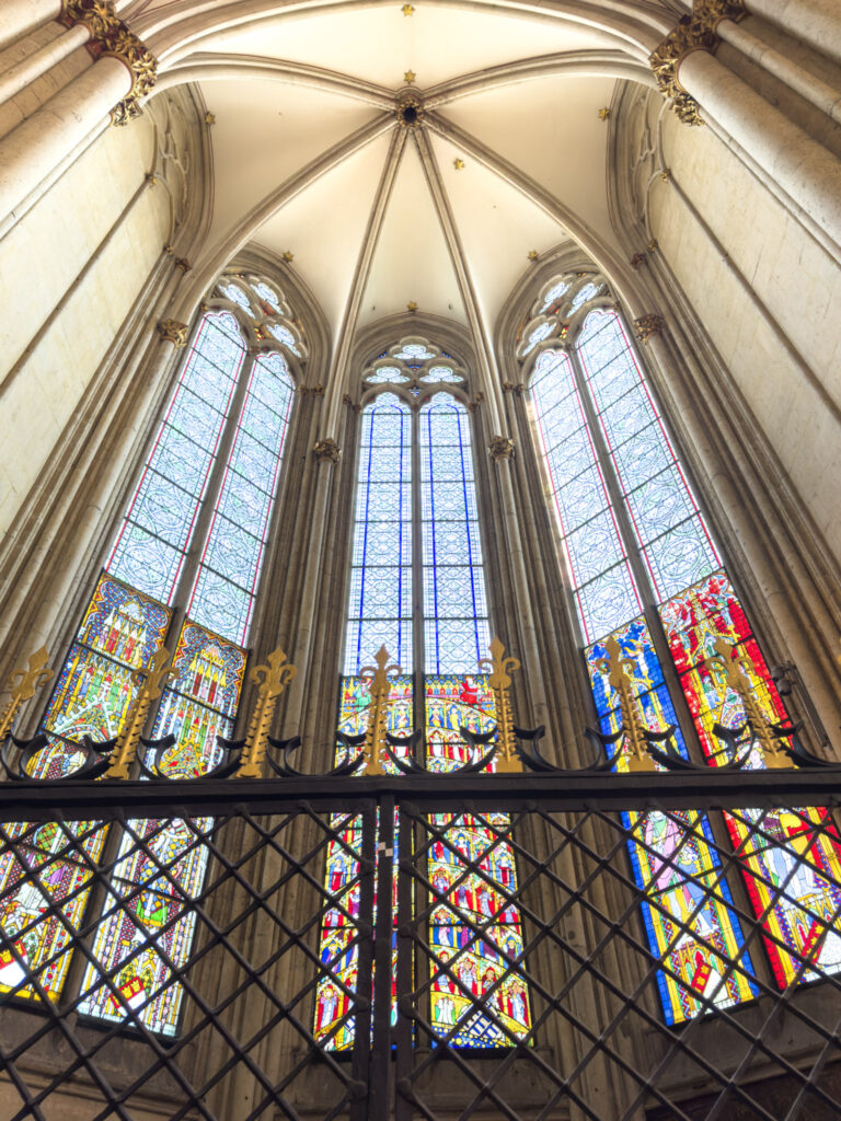 nave with stained glass windows and ceiling