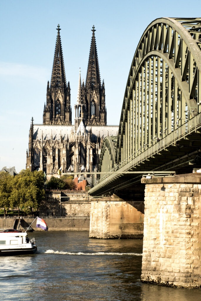 What to See + Do in Cologne in One Day 2 iron bridge with cologne cathedral while spending a day in Cologne