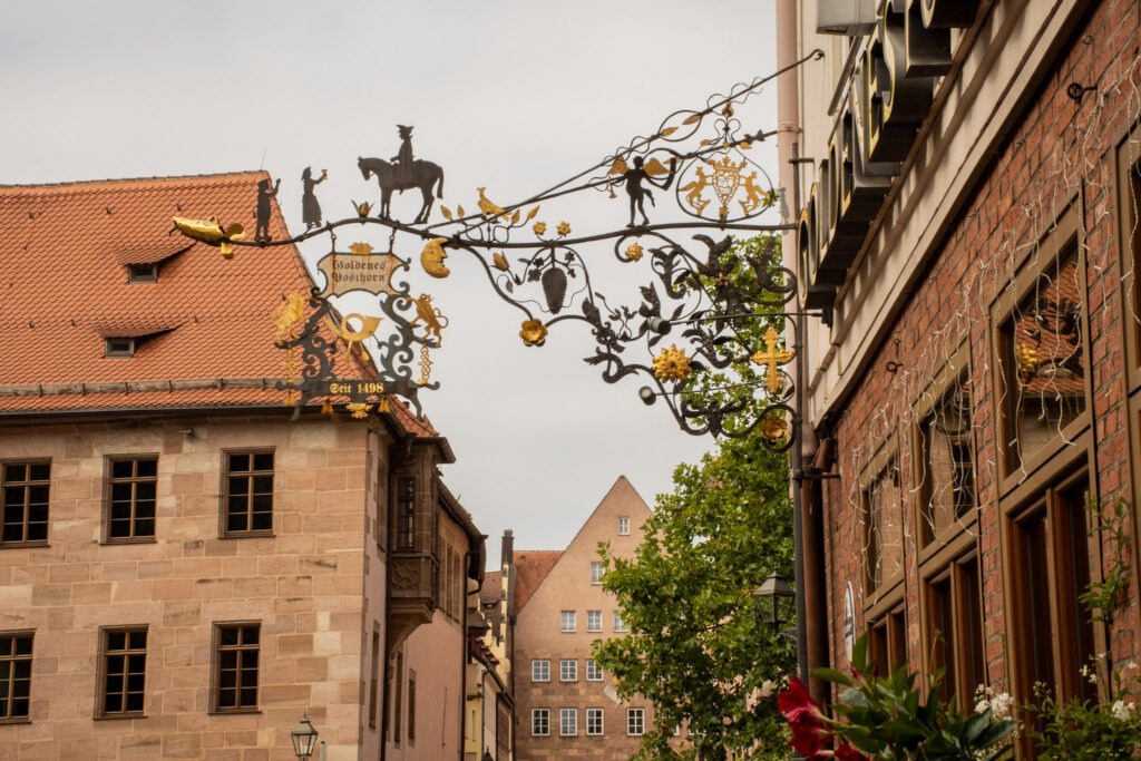building with iron sign in the medieval town of nuremberg