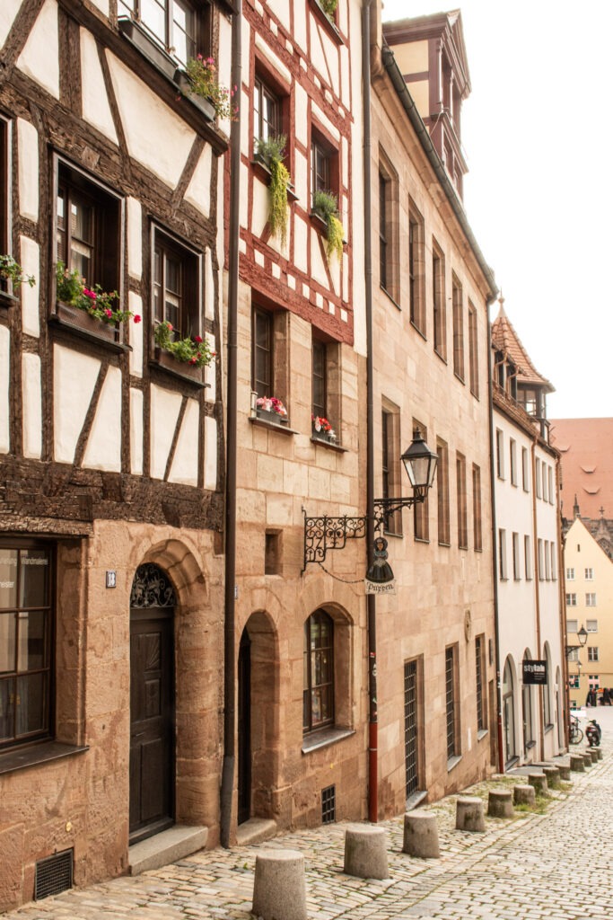timberframed building with curved street with tall buildings in nuremberg