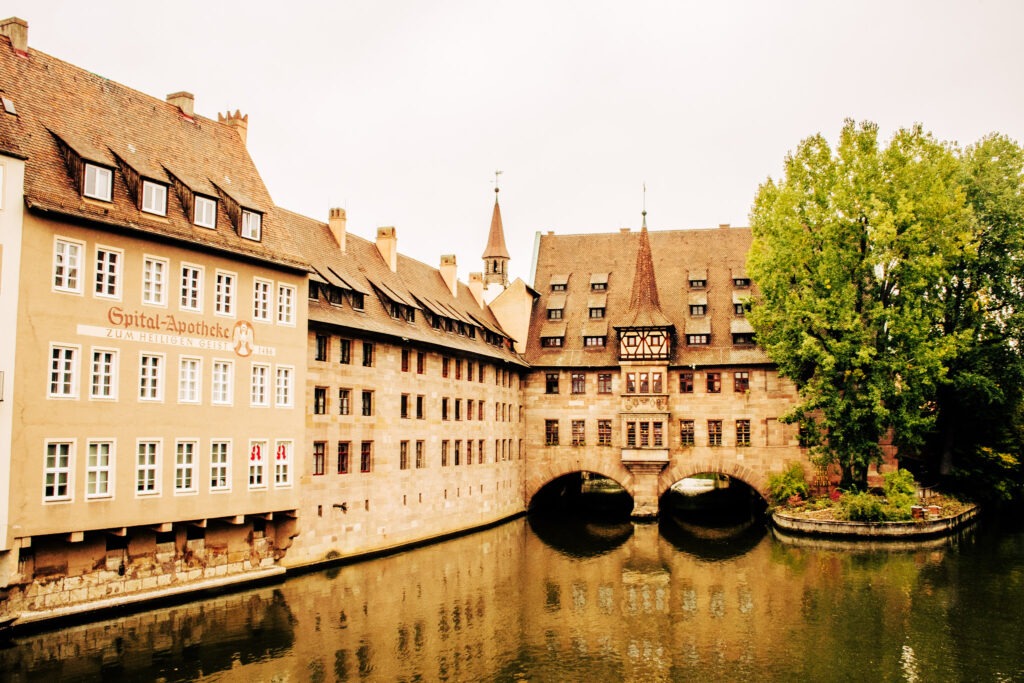 Wondering how many days in Nuremberg are enough? The image of river and bridge is scenic ideal to see in 1 or 2 days