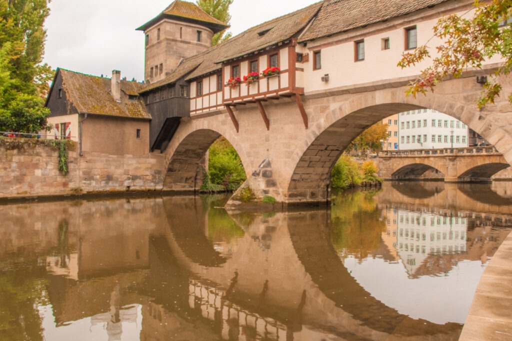 ancient medieval bridge with water reflection in nuremburg 