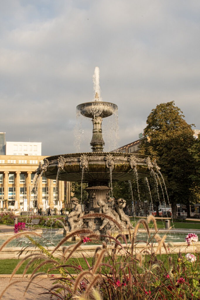 fountain with theatre in background while visiting stuttgart germany