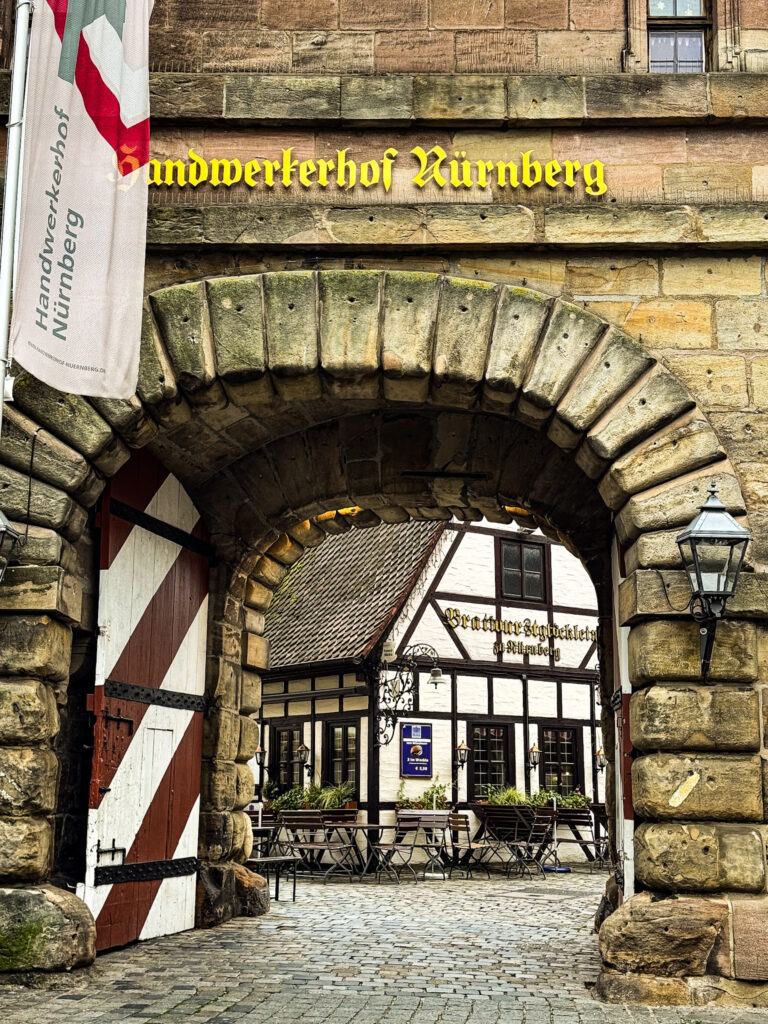 Top Nuremberg Attractions for Thoughtful Travellers 7 tunnel with view to timber framed building in nuremberg