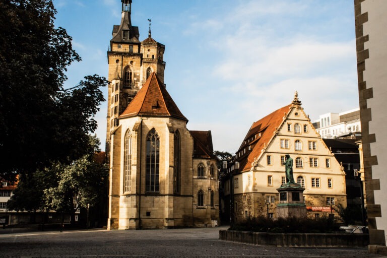 church and building on square while spending one day in Stuttgart Germany
