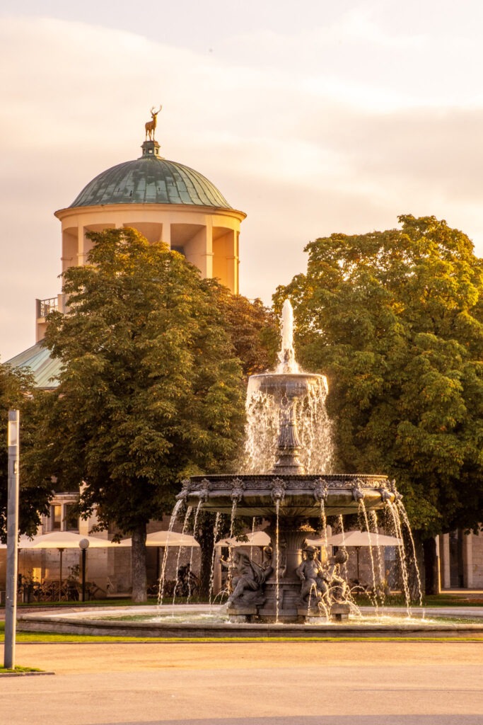 fountain with dome in background in the cultured city of stuttgart