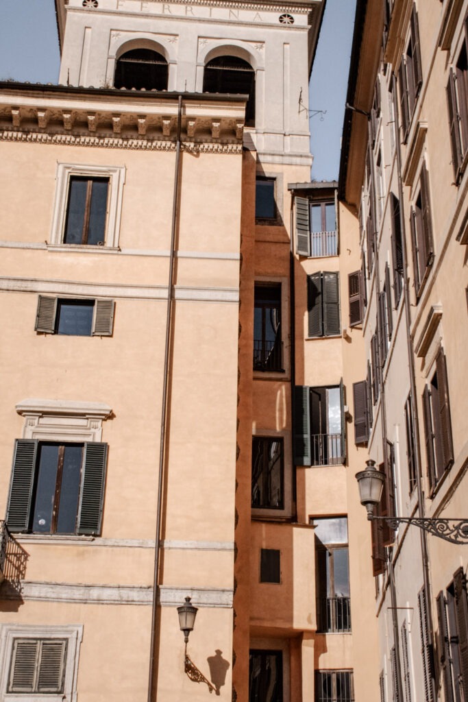 pink buildings with shutters while walking in rome for two days