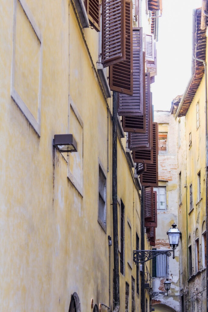 view of yellow building with brown shutters while in florence for 3 days