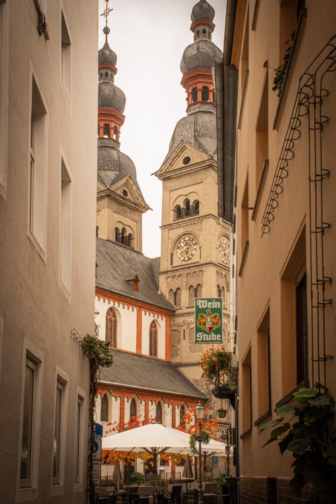 view of church in koblenz between two buildings 