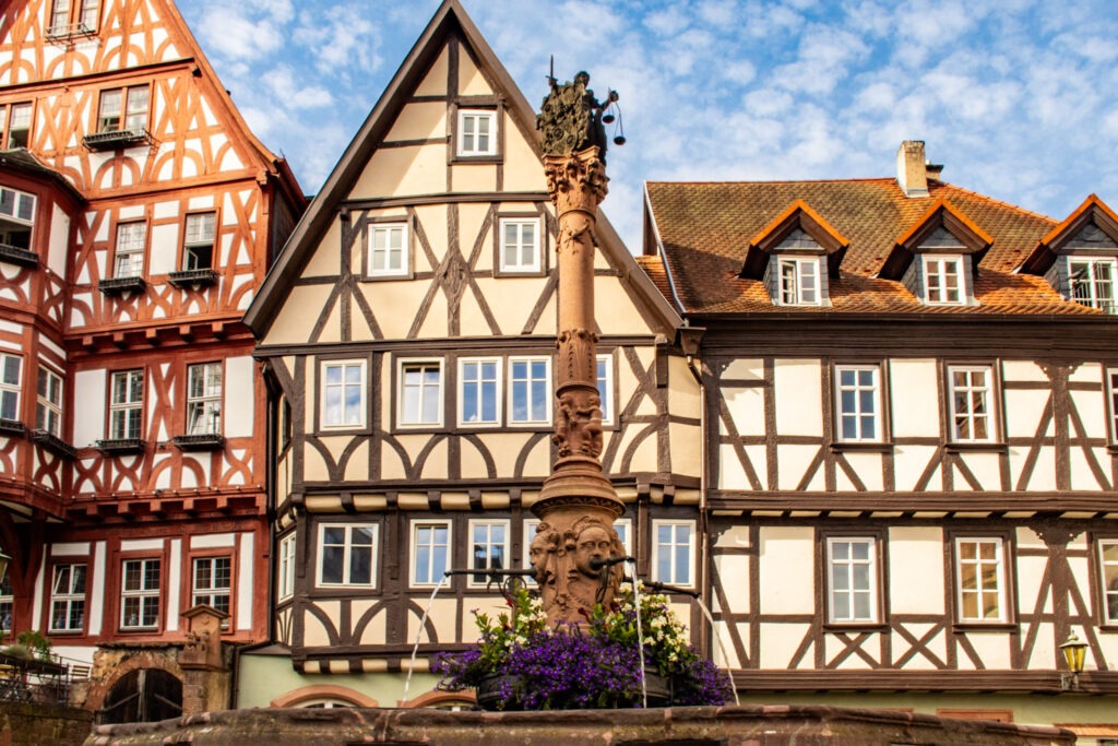 Miltenberg, Germany: A Beautiful Town Near Frankfurt 6 three timber frame buildings behind a fountain in the miltenberg marktplatz