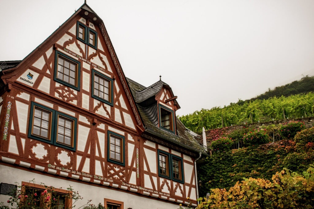 red and white timber frame building on a foggy day while on a walk through town, one of the best things to do in bacharach germany