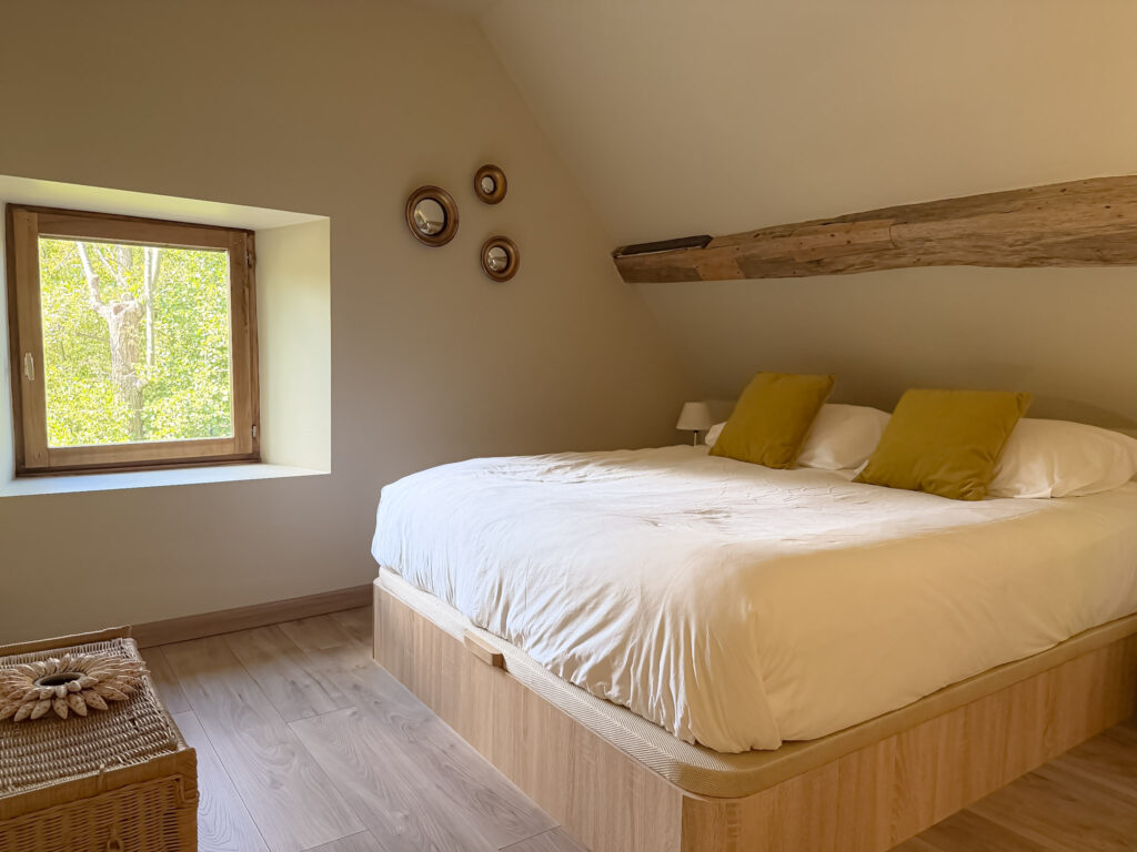 Upstairs bedroom at Moulin de Rochopt, a historic stay near Paris
