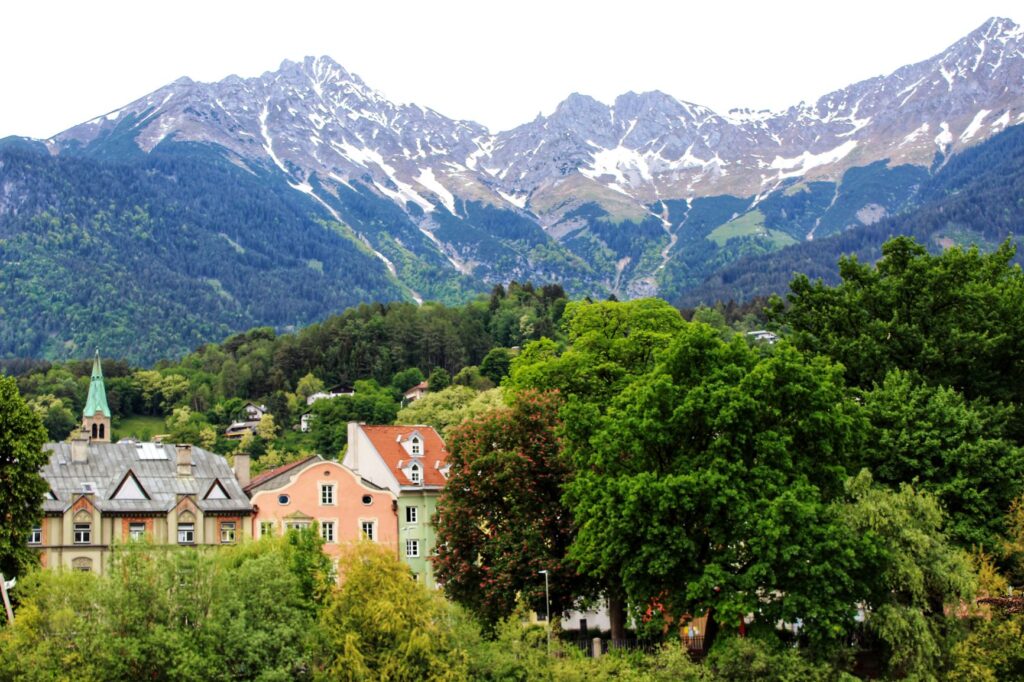 mountains with green trees and city of Innsbruck 